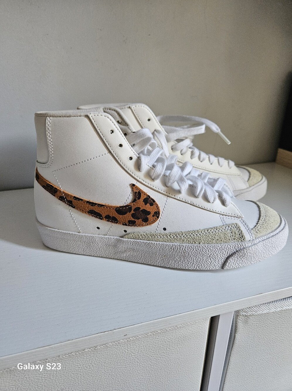 Nike White High-Top Sneakers with Leopard-Print Swoosh